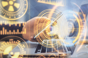 Double exposure of man's hands holding and using a digital device and tech theme hologram drawing. Technology concept.