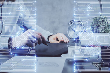 Double exposure of man's hands holding and using a digital device and tech theme hologram drawing. Technology concept.
