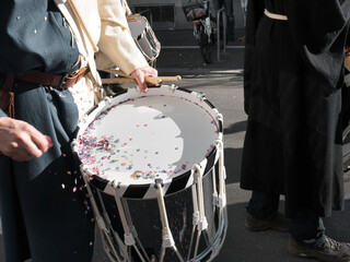 Basler drum with confetti at the Lucerne carnival ("Lozärner Fasnacht"). 