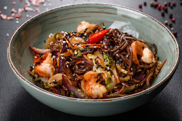Delicious fresh pasta with tomatoes, shrimp and spices