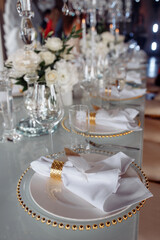 Cutlery on the table. Banquet and wedding table setting. Banquet accessories. Close-up.
