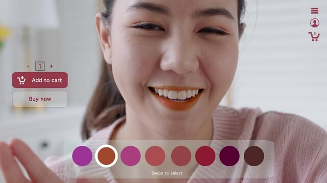 POV asia young teen girl relax happy smile enjoy buy home apply lips makeup ai ar vr mixed augmented reality e-commerce store future fashion mall app in iot smart touch swipe select color web screen.