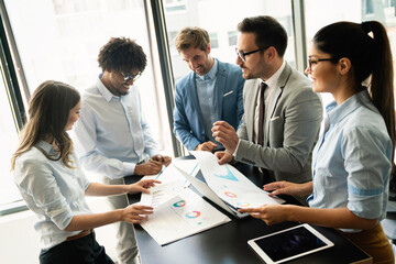 Portrait of business people, architects having discussion in office