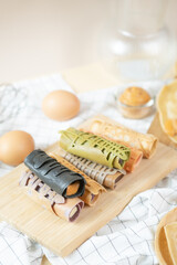 Crispy crepe roll with fresh sweet cream. Thai dessert call ‘kanhom tokyo’.