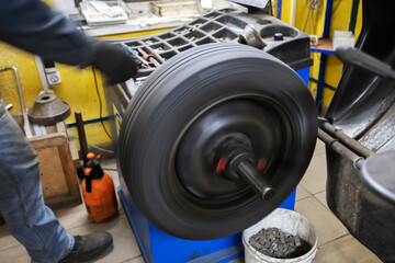 Car wheel repair in a tire workshop.