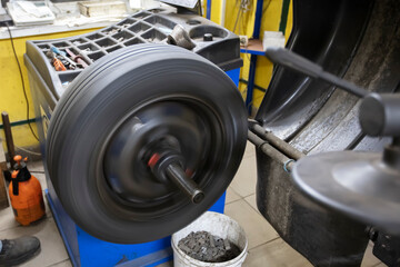 Car wheel repair in a tire workshop.