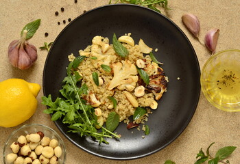 Baked cauliflower, quinoa and hazelnut salad, top view
