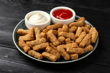 Party finger food southern style chicken breast bites served with ketchup and mayonnaise