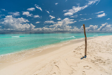 Paradise white sand beach and turquoise water in nice summer day, Gulhi Island, Maldives