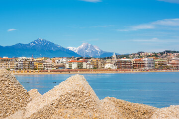 View of the Pescara seafront, with the bell tower of the Divino Amore church and the Gran Sasso