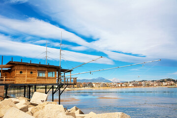Trabucco al porto, overlooking the Pescara seafront, with the bell tower of the Divino Amore church...