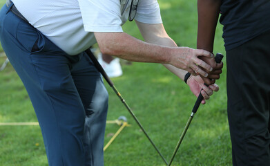 Fototapeta na wymiar golf instruction to African American kids
