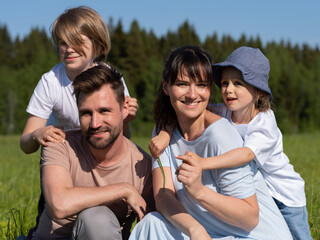 Fototapeta premium Family outdoors smiling