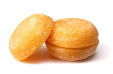 three cakes of palm sugar isolated on white background