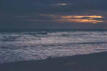 Vintage and retro toning of tropical beach with blue sky and clear sea which including of a wooden umbrella and chair in sunrise time with vintage retro tone. Vacation time as concept.	