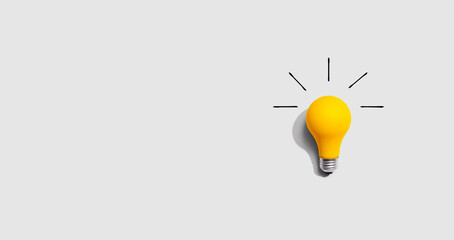 Yellow light bulb - Powered by Adobe