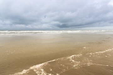 Vintage and retro toning of tropical beach with blue sky and clear sea which including of a wooden umbrella and chair in sunrise time with vintage retro tone. Vacation time as concept.	