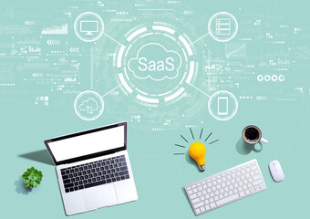 SaaS - software as a service concept with computers with a light bulb