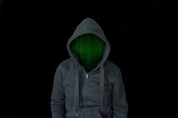 Person in a black hoodie with a green matrix instead of a face in front of a black background...