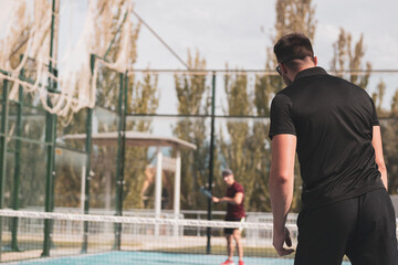 paddle tennis players playing a game