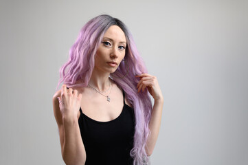 Photo of a caucasian girl with multi-colored hair. Isolated portrait on white background