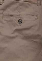 Back pocket with buttoned beige pants