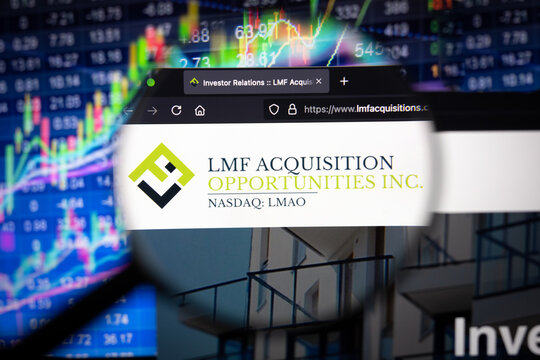 LMF Acquisition company logo on a website with blurry stock market developments in the background, seen on a computer screen through a magnifying glass