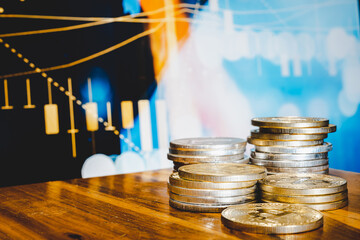 Gold coins stacks is representing riches and wealth management. Coin stack growing and find out the way to get a return on investment. Finance and money exchange investment as concept.	