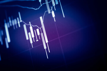 Financial data of stock market in term of a digital prices on LED display. A number of daily market price and quotation of prices chart to represent candle stick tracking in Forex trading.	
