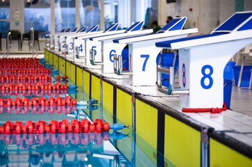 Aligned swimming starting block and platform with numbers