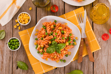 Fusilli pasta with peas and sweet corn.