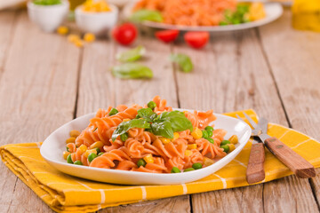 Fusilli pasta with peas and sweet corn.
