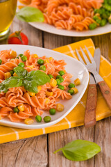 Fusilli pasta with peas and sweet corn.