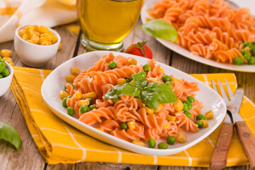Fusilli pasta with peas and sweet corn.