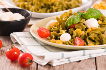 Fusilli pasta with cherry tomatoes and sweet corn.