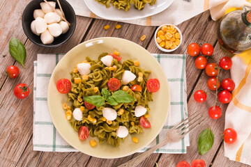 Fusilli pasta with cherry tomatoes and sweet corn.