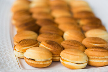 Homemade Russian traditional cookies or cakes in the shape of nuts filled with boiled condensed milk