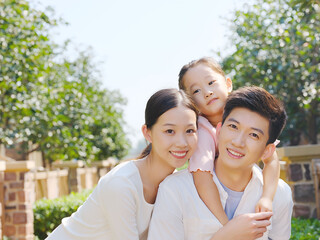 Happy family of three in the outdoor group photo