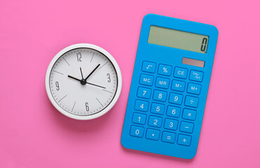 White clock and calculator on pink background. Minimalistic studio shot. Top view