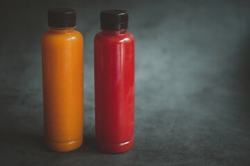Watermelon and orange juice in plastic bottle