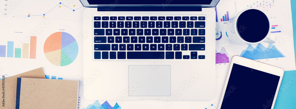 Poster laptop computer and documents report statistic financial with graph and chart and glasses and tablet