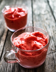 Strawberry ice cream on wooden background
