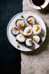 Homemade sushi rolls set with salmon, japanese omelette, avacado and soy sauce