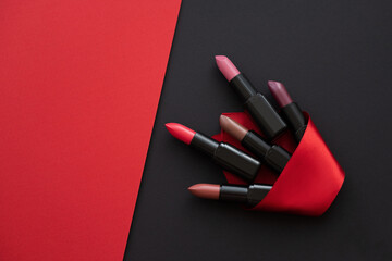 womens cosmetics on dark background