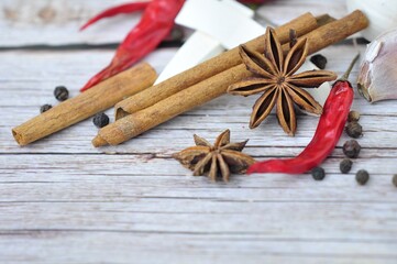 Herb spices such as Anise or octagonal sandalwood, cinnamon, black pepper, garlic, chili,on wooden background