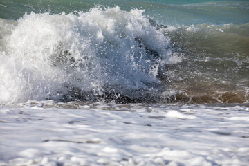 big sea waves with foam near the shore, horizontal