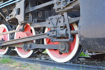 Close-up of a wheel of a retro steam locomotive.