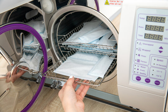 Sterilizing medical instruments in autoclave in dental office
