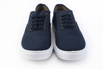 Blue pair of sneakers on a white background. 