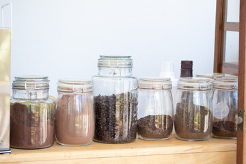 Glass jar for tea, coffee, cocoa powder in a coffee shop